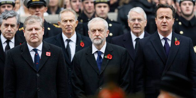 Britain's Prime Minister David Cameron, right, and Leader of the opposition Labour Party Jeremy Corbyn, centre, with SNP representative Angus Robertson, left, attend the Remembrance Sunday ceremony at the Cenotaph in London, Sunday, Nov. 8, 2015, with Britain's Queen Elizabeth II, extreme foreground right. Remembrance Sunday is held each year to commemorate the service men and women who fought in past military conflicts. (AP Photo/Kirsty Wigglesworth)
