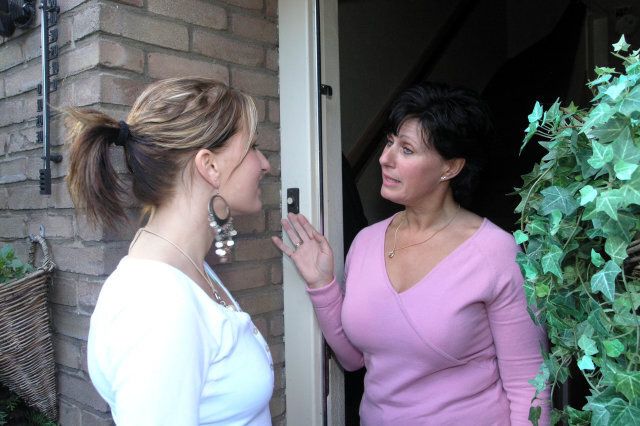 Women talking in open door
