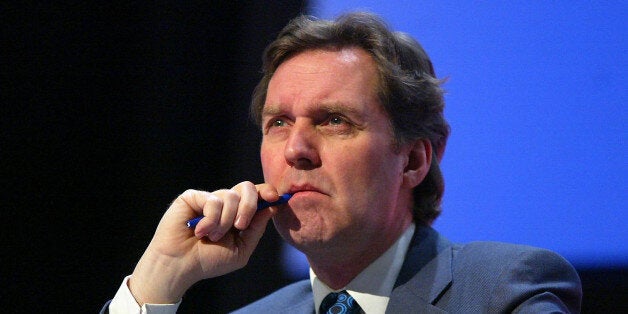 Alan Milburn before speaking.