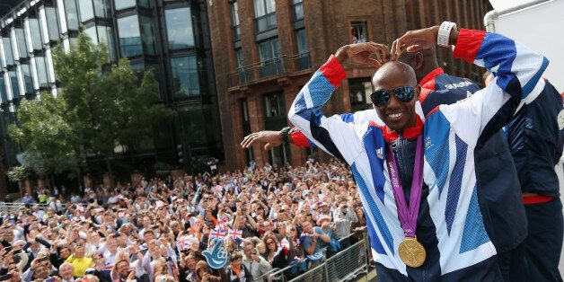 Mo Farah performs a mobot during the London 2012 Victory Parade for Team GB and Paralympic GB athletes