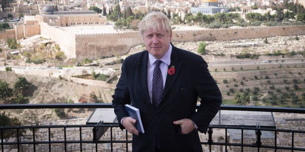 Mayor of London Boris Johnson looks out over the Old City of Jerusalem from the Mount of Olives today during a tour of the historic town where he also prayed at the Western Wall, on the third day of his trade visit to Israel.