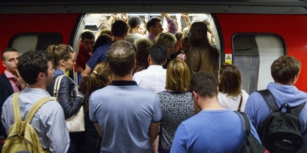 LONDON, UNITED KINGDOM - JULY 08: Commuters queuing for tube trains at Green Park Tube Station ahead of the tube strike in evening rush hour of July 8, 2015 in London, England. The strike will be a 27-hour stoppage by about 20,000 Tube staff to shut down the entire London Underground network. (Photo by Tolga Akmen/Anadolu Agency/Getty Images)