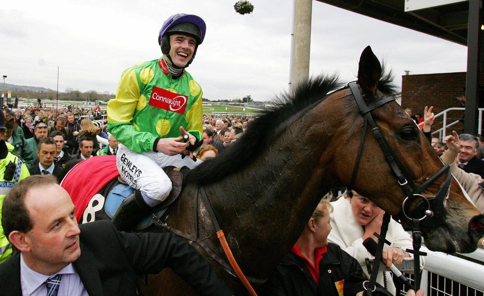 The jockey Ruby Walsh celebrates with ho