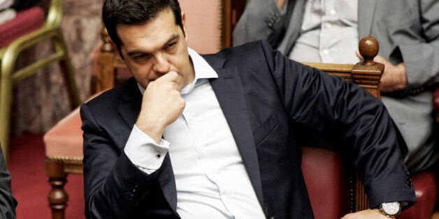 ATHENS, GREECE - JUNE 27:Greek Prime Minister Alexis Tsipras during a parliamentary session in Athens, Greece June 28, 2015 . Greece's fraught bailout talks with its creditors took a dramatic turn early Saturday, with the radical left government announcing a referendum in just over a week on the latest proposed deal . (Photo by Milos Bicanski/Getty Images)