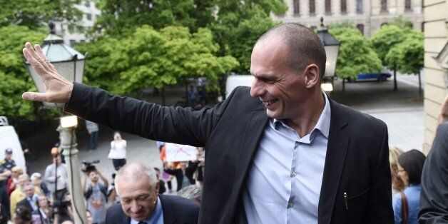 Greek Finance Minister Yanis Varoufakis waves as he arrives to take part in a discussion on the future of Greece in the EU in Berlin on June 8, 2015. The Greek finance minister met with several politicians including his German counterpart during his visit to Berlin. AFP PHOTO / ODD ANDERSEN (Photo credit should read ODD ANDERSEN/AFP/Getty Images)