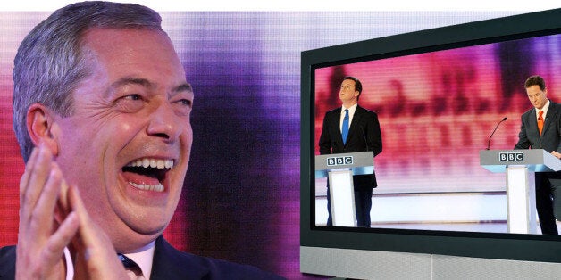 Nigel Farage (L), leader of the UK Independence Party (UKIP), is pictured before unveiling a campaign poster ahead of the Heywood and Middleton by-election, visit the Heywood Tank Museum in Heywood, Greater Manchester, on October 7, 2014. AFP PHOTO / OLI SCARFF (Photo credit should read OLI SCARFF/AFP/Getty Images)