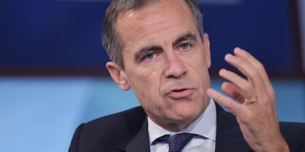 Bank of England Governor Mark Carney speaks during a discussion on ethics and finance at the 2014 IMF - World Bank Annual Meetings at George Washington University's Jack Morton Auditorium on October 12, 2014 in Washington, DC. AFP PHOTO/Mandel NGAN (Photo credit should read MANDEL NGAN/AFP/Getty Images)