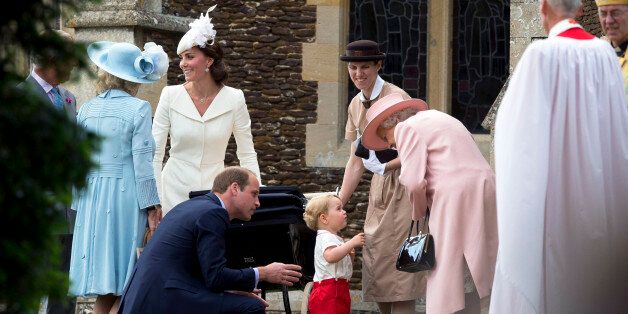 KING'S LYNN, ENGLAND - JULY 05: Queen Elizabeth II speaks to Prince George of Cambridge as Catherine, Duchess of Cambridge, Prince William, Duke of Cambridge and Princess Charlotte of Cambridge leave the Church of St Mary Magdalene on the Sandringham Estate after the Christening of Princess Charlotte of Cambridge on July 5, 2015 in King's Lynn, England. (Photo by Matt Dunham - WPA Pool/Getty Images)