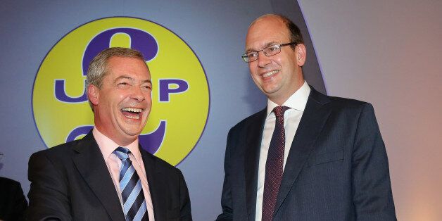 DONCASTER, ENGLAND - SEPTEMBER 27: Conservative MP Mark Reckless is welcomed to UKIP by party leader Nigel Farage after the tory MP announced he was defecting on the second day of the UKIP (UK Independence Party) party conference at Doncaster Racecourse on September 27, 2014 in Doncaster, England. Party leader Nigel Farage declared that in the run up to next years general election UKIP will be targeting voters in Conservative and Labour heartlands. (Photo by Christopher Furlong/Getty Images)