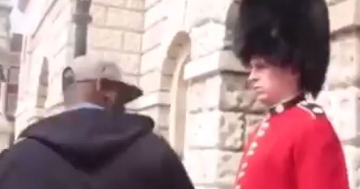 Tourist Gets Knocked Out By 'Queen's Royal Guard' In Fake Soldier Prank