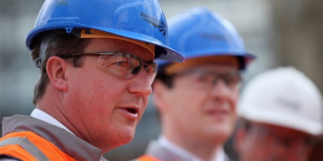 MANCHESTER, ENGLAND - JUNE 23: British Prime Minister David Cameron (L) and British Chancellor George Osborne tour building works at Manchester's Victoria Railway Station which is being upgraded on June 23, 2014 in Manchester, England. Chancellor George Osborne earlier spoke of a proposed HS3 high-speed rail link between Manchester and Leeds that would help build a 'northern global powerhouse' linking cities across the North of England. (Photo by Christopher Furlong - WPA Pool /Getty Images)