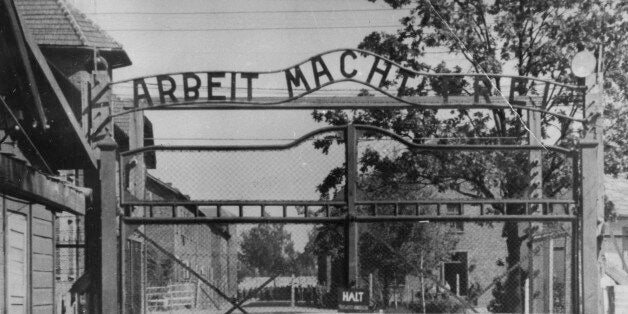 FILE - This undated file image shows the main gate of the Nazi concentration camp Auschwitz I, near Oswiecim , Poland, which was liberated by the Russians in January 1945. Writing at the gate reads: