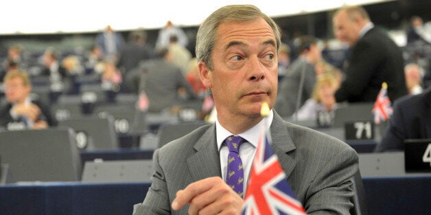 UKIP party leader Britain's Nigel Farage listen to debates Tuesday July 15, 2014 at the European Parliament in Strasbourg, eastern France. The European Parliament has elected former Luxembourg Prime Minister Jean-Claude Juncker as the new leader of the 28-nation bloc's executive arm. Lawmakers voted 422-250 for the 59-year-old who will take over as European Commission President in November from the incumbent, Jose Manuel Barroso of Portugal. (AP Photo/Christian Lutz)