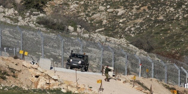 Israeli troops patrol the Israeli-occupied sector of the Golan Heights on the border with Syria after a soldier was moderately injured by a landmine explosion in the occupied Golan Heights on February 04, 2015.