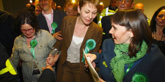 Caroline Lucas (centre) celebrates after becoming Britain's first Green Party MP after winning the Brighton Pavilion seat at the 2010 General Election count at the Brighton Centre in East Sussex.