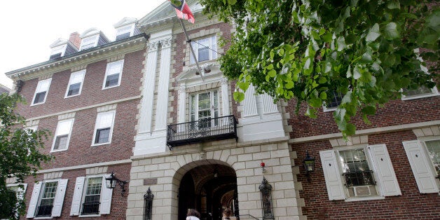 Students walk into Kirkland House on the campus of Harvard University in Cambridge, Mass. Wednesday, May 16, 2012. Mark Zuckerberg created the social networking website that came to be known as Facebook, in his Kirkland House dorm room in 2004. (AP Photo/Elise Amendola)