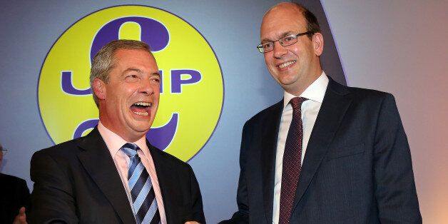 Conservative MP Mark Reckless (R) is welcomed to UKIP by party leader Nigel Farage after the tory MP announced he was defecting on the second day of the UKIP (UK Independence Party) party conference at Doncaster Racecourse on September 27, 2014 in Doncaster, England. Party leader Nigel Farage declared that in the run up to next years general election UKIP will be targeting voters in Conservative and Labour heartlands. (Photo by Christopher Furlong/Getty Images)