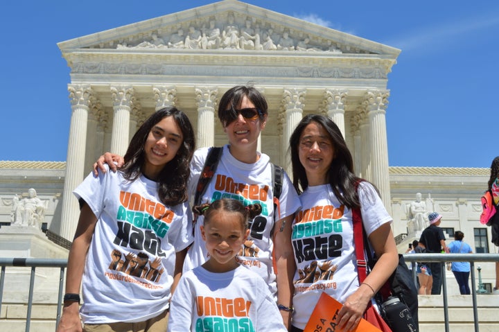 Ali Wicks stands with her family in front of the Supreme Court.