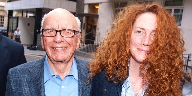 News International chief executive Rebekah Brooks and Rupert Murdoch are seen outside Mr Murdochs London flat.