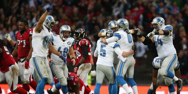 LONDON, ENGLAND - OCTOBER 26: Matt Prater #5 of the Detroit Lions celebrates with team mates after kicking a 48 yard field to win the game during the NFL match between Detroit Lions and Atlanta Falcons at Wembley Stadium on October 26, 2014 in London, England. (Photo by Jordan Mansfield/Getty Images)