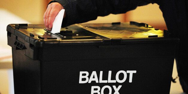 File photo dated 06/05/10 of a voter placing a ballot paper in a ballot box, as the Government's promised "tax lock" was a key Conservative pledge made in the closing stages of the general election campaign.