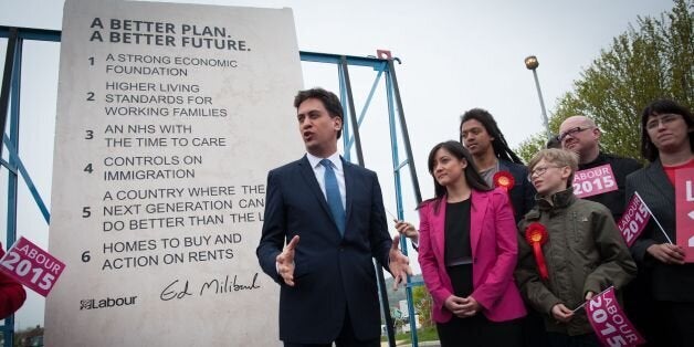 Labour leader Ed Miliband unveils Labour's pledges carved into a stone plinth in Hastings during General Election campaigning.