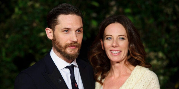 Tom Hardy and Kelly Marcel arrive for the British Academy Film Awards 2014 After Party at the Grosvenor Hotel, in central London, Sunday, Feb. 16, 2014. (Photo by Jonathan Short/Invision/AP)