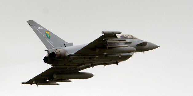 A British Royal Air Force (RAF) Typhoon jet fighter departs Gioia del Colle air base, Italy, Tuesday, March 22, 2011.