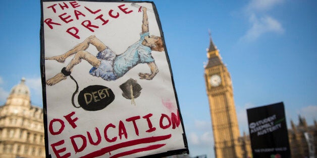 LONDON, ENGLAND - NOVEMBER 19: Protestors gather in Parliament Square during a march against student university fees on November 19, 2014 in London, England. A coalition of student groups have organised a day of nationwide protests in support of free education and to campaign against cuts. (Photo by Rob Stothard/Getty Images)