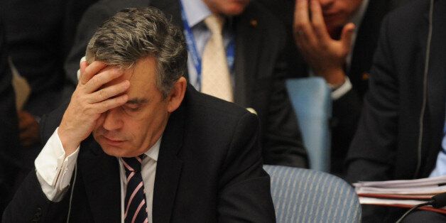 Britain's Prime Minister Gordon Brown prepares to speak at the UN Security Council in New York, while Britain's Foreign Secretary David Miliband looks on in the background.