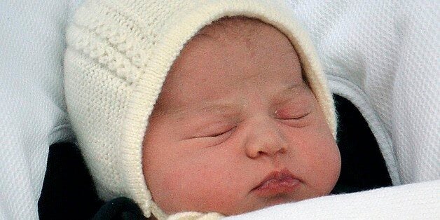 FILE - In this Saturday, May 2, 2015. file photo the newborn baby princess, born to parents Kate Duchess of Cambridge and Prince William, is carried in a car seat by her father from The Lindo Wing of St. Mary's Hospital, in London Britain's newborn princess has been named Charlotte Elizabeth Diana it was announced on Monday May 4. (John Stillwell/Pool via AP, File)