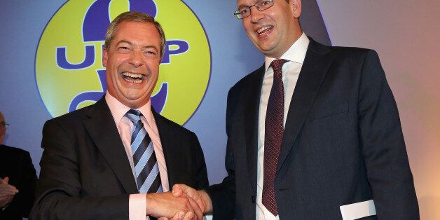 DONCASTER, ENGLAND - SEPTEMBER 27: Conservative MP Mark Reckless (R) is welcomed to UKIP by party leader Nigel Farage after the tory MP announced he was defecting on the second day of the UKIP (UK Independence Party) party conference at Doncaster Racecourse on September 27, 2014 in Doncaster, England. Party leader Nigel Farage declared that in the run up to next years general election UKIP will be targeting voters in Conservative and Labour heartlands. (Photo by Christopher Furlong/Getty Imag