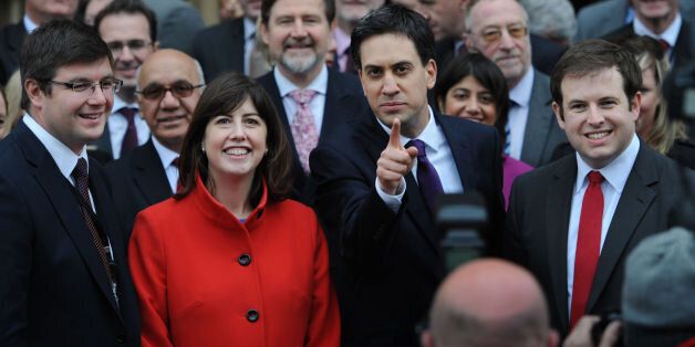 Labour leader Ed Miliband welcomes the newly elected members of parliament to the House of Commons in London, MP for Corby, Andy Sawford (left), MP for Manchester Central, Lucy Powell (second left) and MP for Cardiff South and Penarth, Stephen Doughty (right) after winning their seats in the recent by-elections.