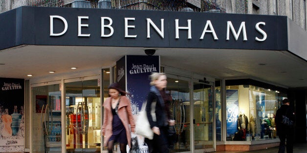 Pedestrians pass the entrance to a Debenhams store on Oxford Street in London, U.K., on Tuesday, Jan. 10, 2012. Debenhams Plc, the U.K.'s second-largest department-store chain, rose the most in more than 2 1/2 years in London trading after holiday sales beat estimates and the retailer said it expects commodity-cost pressure to ease. Photographer: Simon Dawson/Bloomberg via Getty Images