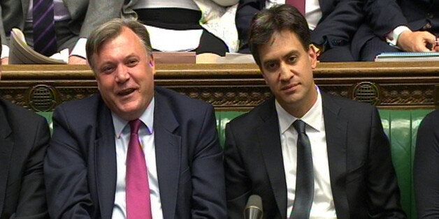 Shadow chancellor Ed Balls and Labour party leader Ed Miliband during Prime Minister's Questions in the House of Commons, London.