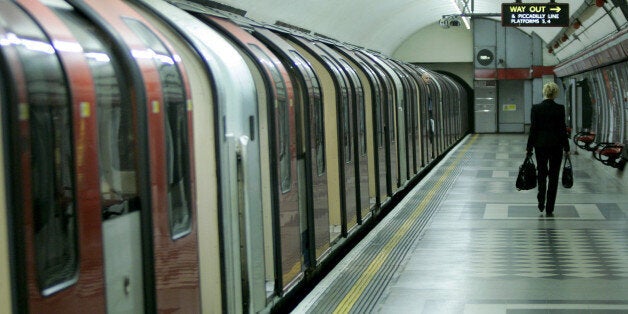 A lone commuter walks away after getting off a Central Line train during morning rush hour at Holborn underground station in London, Friday July 8, 2005. A series of deadly explosions in London on Thursday claimed at least 37 lives and injured hundreds of others. Britain's top law-enforcement official said Friday that the bombers who hit London's transportation network could strike again. Britain's Home Secretary Charles Clarke said police have not ruled out the possibility that one or more of t