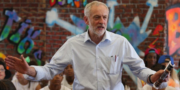 LONDON, ENGLAND - JULY 16: Labour leadership contender Jeremy Corbyn presents pupils with certificates after they perform in a play on their last day of school at Duncombe Primary School on July 16, 2015 in London, England. Jeremy Bernard Corbyn is a British Labour Party politician and has been a member of Parliament for Islington North since 1983. He is currently a contender for the position as leader of the Labour Party. (Photo by Dan Kitwood/Getty Images)