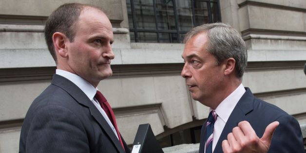 UKIP leader Nigel Farage (right) with Douglas Carswell after a press conference in central London where the Conservative MP defected to his party today.