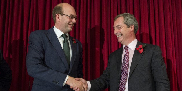 ROCHESTER, ENGLAND - NOVEMBER 04: United Kingdom Independence Party (UKIP) parliamentary candidate Mark Reckless (L) shakes hand with the UKIP leader Nigel Farage (R) at a sold-out public meeting Hoo Village Institute on November 4, 2014 in Rochester, England. Rochester and Strood will hold a by-election on November 20th following the defection of Conservative Party Member of Parliament, Mark Reckless to the United Kingdom Independence Party (UKIP). (Photo by Rob Stothard/Getty Images)