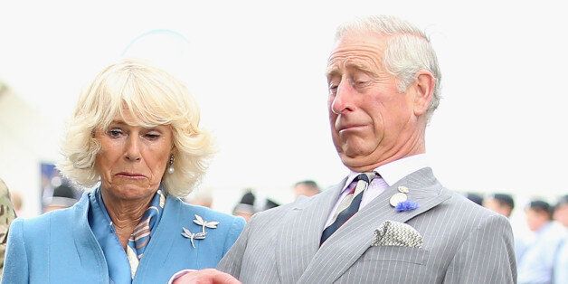 KING'S LYNN, ENGLAND - JULY 29: Prince Charles, Prince of Wales and Camilla, Duchess of Cornwall react as Zephyr (a bald eagle), the mascot of the Army Air Corps flaps his wings at Sandringham Flower Show on July 29, 2015 in King's Lynn, England. (Photo by Chris Jackson/Getty Images)