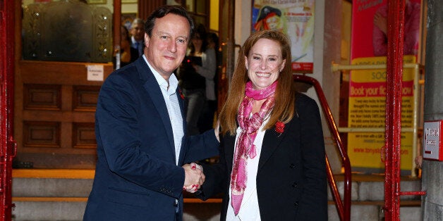 Prime Minister David Cameron with Kelly Tolhurst, the Conservative candidate in the Rochester and Strood by-election, pose for photographs as they leave the Brook Theatre in Chatham, Kent, following a community forum meeting.