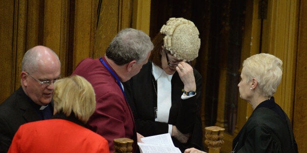 Reverend John Chalmers, principal clerk to the General Assembly, talks with the procurator Laura Dunlop QC during the debate on the issue of gay ministers on May 20,2013 in Edinburgh, Scotland. Members will be discussing whether to allow people in same sex relationships to be ordained as Ministers in the Church of Scotland. (Photo by Jeff J Mitchell/Getty Images)