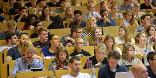 FRANKFURT AM MAIN, GERMANY - OCTOBER 13: Students follow a commercial information technology in a lecture hall of the Johann Wolfang Goethe-University on October 13, 2014 in Frankfurt am Main, Germany. The Johann Wolfgang Goethe-University celebrates its 100th anniversary with a ceremony on 18 October. (Photo by Thomas Lohnes/Getty Images)