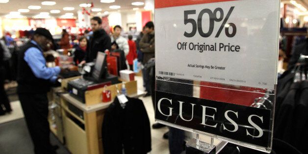 A sign touts discounted merchandise in the Macy's store in downtown Seattle on