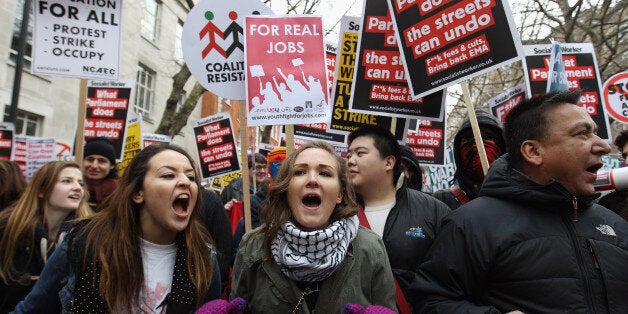 LONDON, UNITED KINGDOM - JANUARY 29 2010: Student demonstrators march to Parliament to protest against the Government's cuts to public services and an increase in tuition fees on January 29, 2010 in London, England. A simultaneous protest is due to take place in Manchester both will be attended by students, union activists and tax avoidance campaigners. (Photo by Oli Scarff/Getty Images)