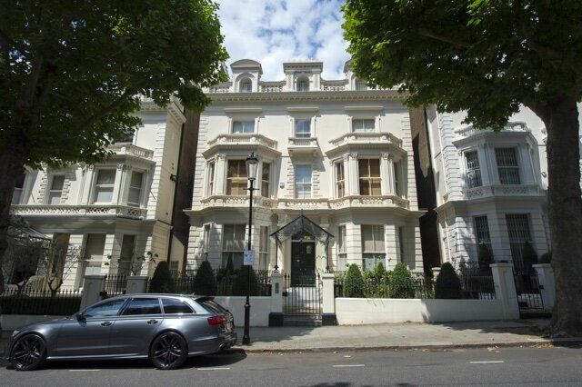 Mandatory Credit: Photo by Lucy Young/REX (3923317e) Home of David and Victoria Beckham David and Victoria Beckham's mansion, West London, Britain - 01 Jul 2014 David and Victoria Beckham's West London mansion which they purchased for Â£31.5 million in September 2013. Interior designer Rose Uniacke, who is married to Harry Potter producer David Heyman, has taken over the Â£5 million refurbishment of the property. The five-storey, 7-bedroom mansion is said to include a hair salon for Victoria and two rooms to house her shoe collection. There will also be a room for hairdressing, manicures and make-up. Staff and security will have access to a tunnel which will take them unseen to a second property. The lower ground includes a study, a gym and massage room, three service rooms and a small garden. There is also an underground garage.