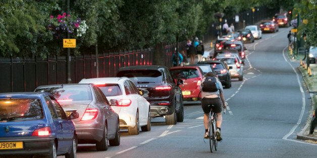 Traffic moves slowly on a road in Wimbledon, south west London, as tennis fans leaving the All England Club faced a difficult journey home due to a Tube strike which will cripple services until Friday morning.