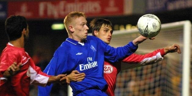 LONDON, UNITED KINGDOM: Chelsea's Swedish player Mikael Forsell (C) is sandwiched by two players of Hapoel Tel Aviv players during a second leg UEFA cup match at Stamford Bridge stadium in London, 01 November 2001. The match ended in a 1-1 draw with 3-1 on aggregate in favor of Tel Aviv. AFP PHOTO Odd ANDERSEN (Photo credit should read Odd Andersen/AFP/Getty Images)