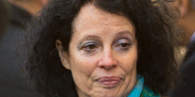 French Ambassador to London Sylvie Agnes-Bermann views tributes to the victims of the terrorist attack on French satirical magazine Charlie Hebdo, outside the French Embassy in Knightsbridge, London.