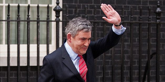 Leader of Britain's ruling Labour Party, Gordon Brown, waves as he walks to his car after announcing his resignation as Prime Minister, in Downing Street in central London on May 11, 2010. British Prime Minister Gordon Brown tendered his resignation Tuesday to Queen Elizabeth II, making way for a new power-sharing government led by Conservative leader David Cameron to be formed. AFP PHOTO/Leon Neal (Photo credit should read LEON NEAL/AFP/Getty Images)